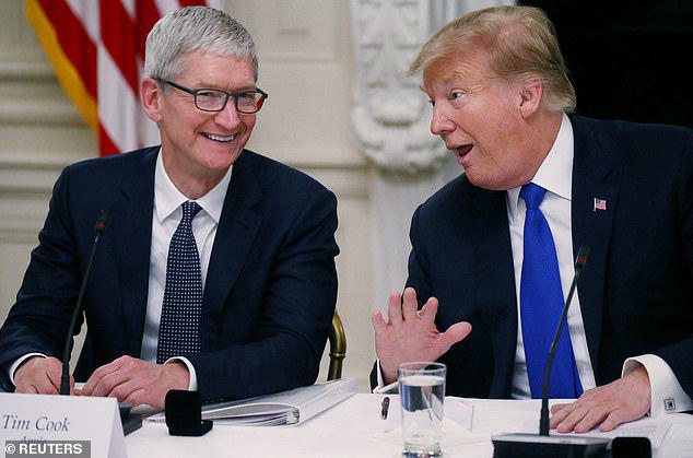 Trump is hoping Apple boss Tim Cook (pictured left) will fire up domestic production of the iPhone to help the United States win the trade war