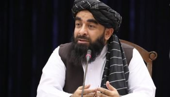 Mujahid’s Denial, the World’s Evidence