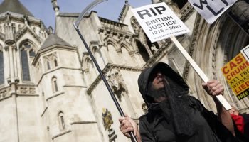 LONDON, ENGLAND - AUGUST 11:  Protesters gather outside as the High Court hears a US appeal in the extradition of WikiLeaks founder Julian Assange, at Royal Courts of Justice, Chancery Lane on August 11, 2021 in London, England. Assange has been held in HMP Belmarsh since his conviction on May 1, 2019, for breaching bail conditions. Previously Judge Vanessa Baraitser denied his extradition to the United States citing him a "suicide risk". He faces charges for hacking computers and violating the country's Espionage Act. The US is appealing the decision today. (Photo by Ming Yeung/Getty Images)